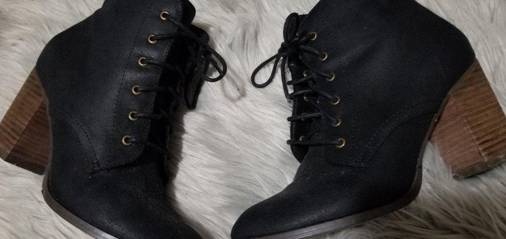 Restricted black lace up bootie